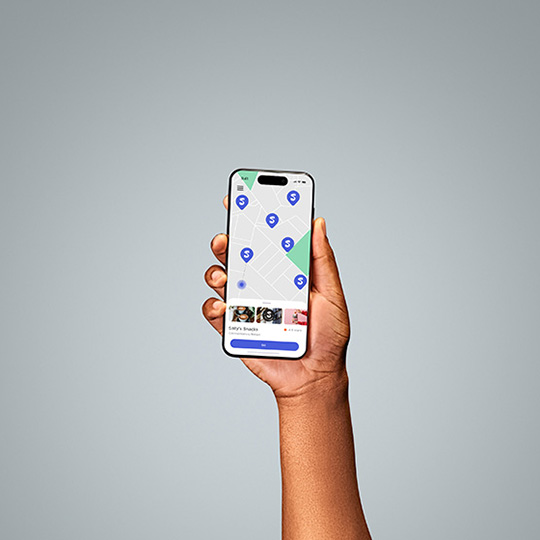 A hand holding a phone with maps mockup
