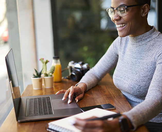 A woman enjoying fast funding services provided by SymPay's POS services